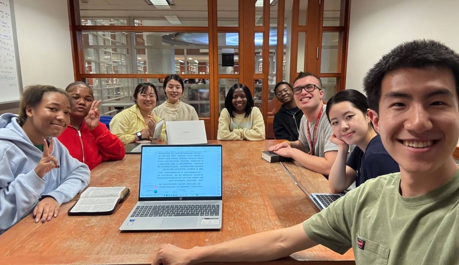 Students studying the Bible together